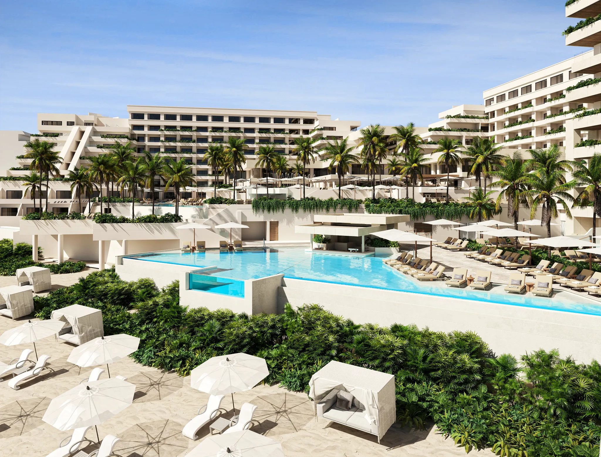 Beachfront pool and resort buildings at Secrets Mirabel Cancun Resort & Spa in Cancun.