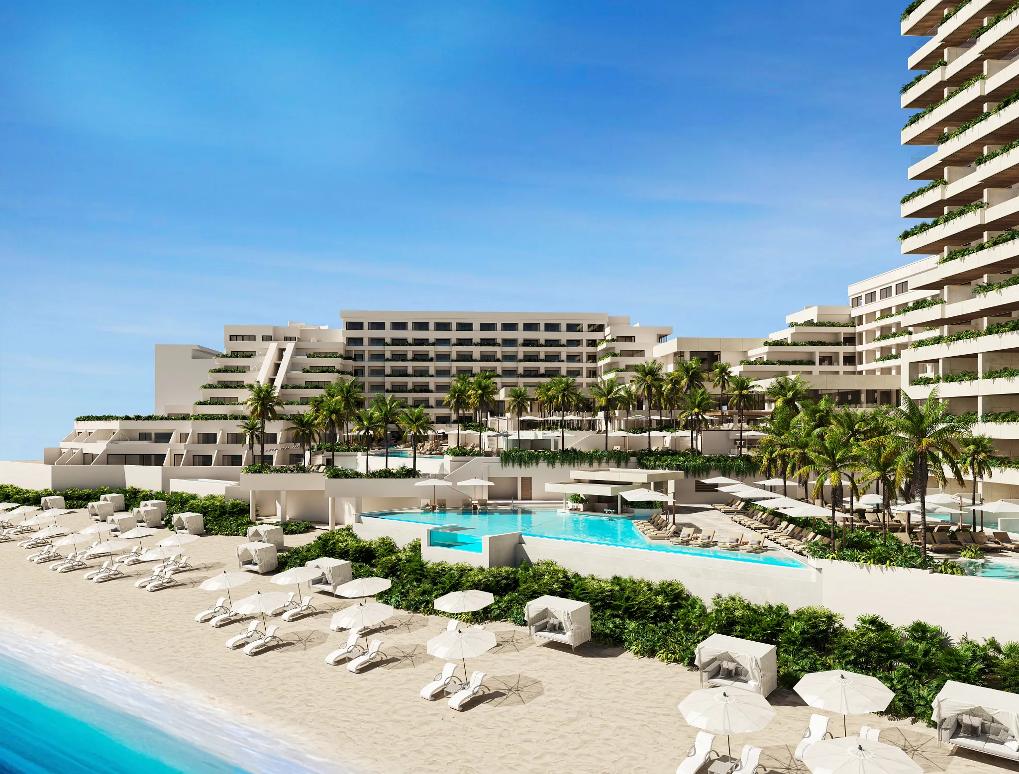 Panoramic beachfront view of Secrets Mirabel Cancun Resort & Spa with pools and white-sand beach.