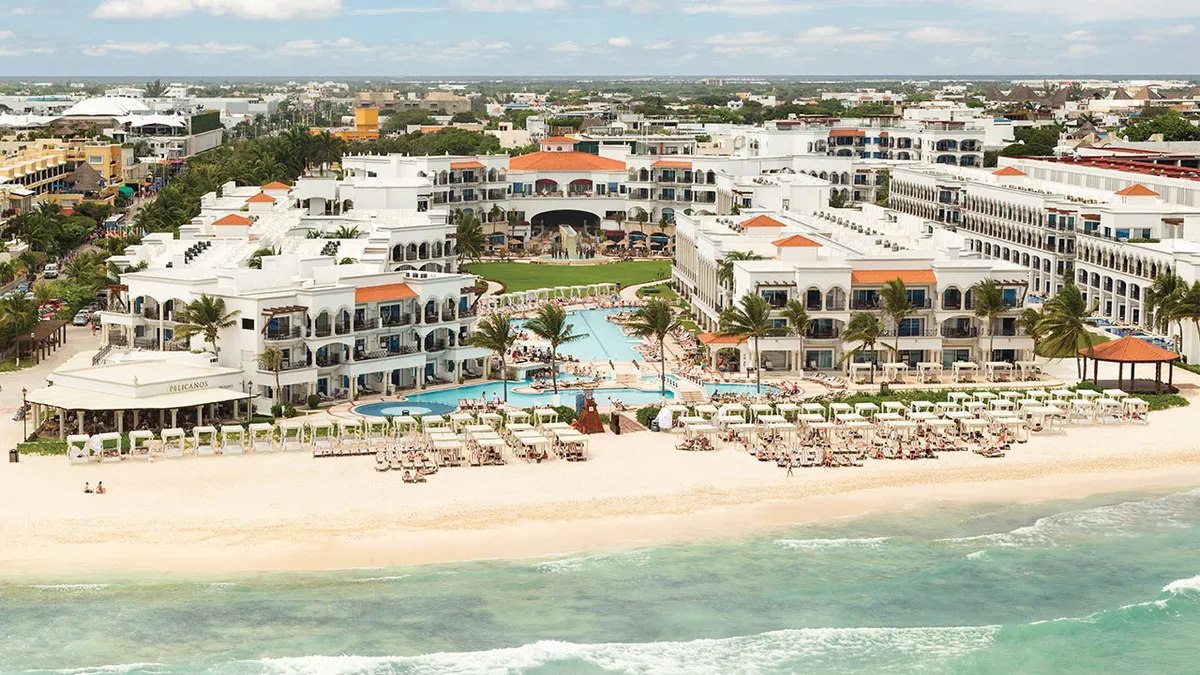 Hilton Playa del Carmen adults-only all-inclusive resort with beachfront pools, modern design, and Fifth Avenue access in Riviera Maya.