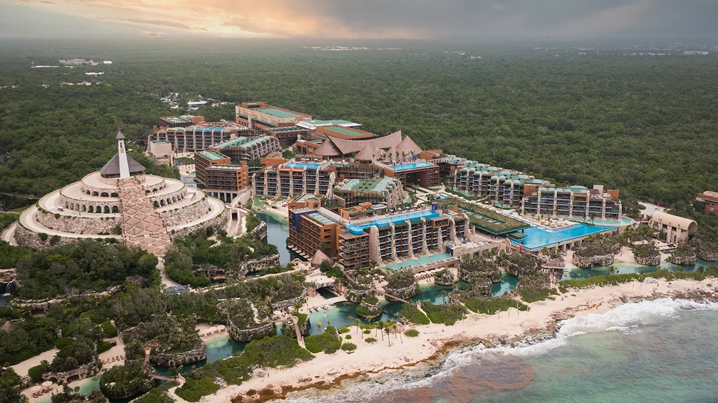 Hotel Xcaret Arte adults-only luxury resort with eco-inspired architecture and riverside pools in Riviera Maya.