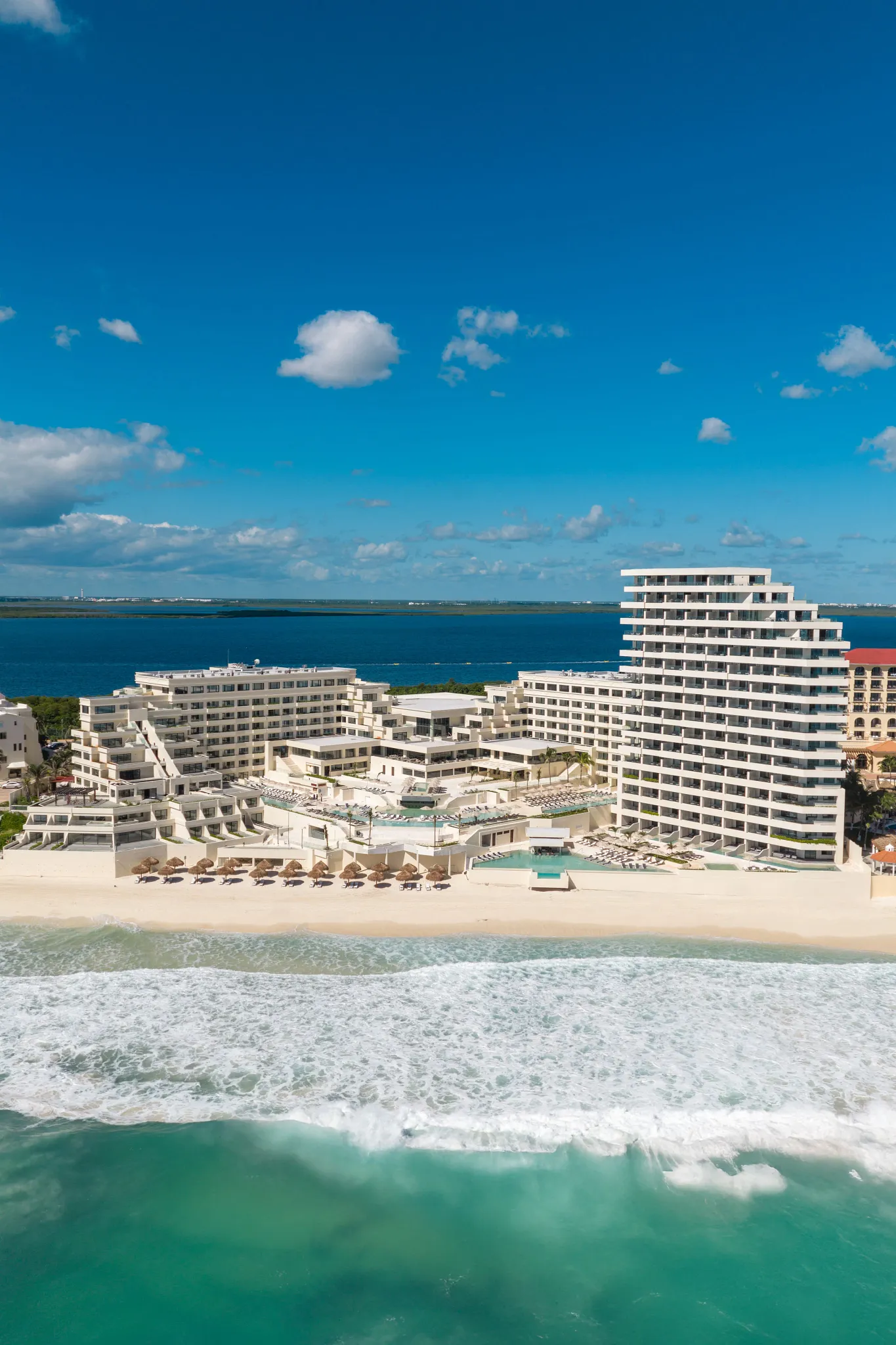Oceanfront aerial view of Secrets Mirabel Cancun Resort & Spa along Cancun’s Caribbean coastline.