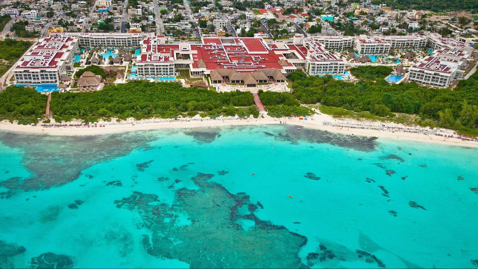 Paradisus La Perla adults-only all-inclusive resort with beachfront suites, luxury pools, and tropical gardens in Playa del Carmen, Mexico.