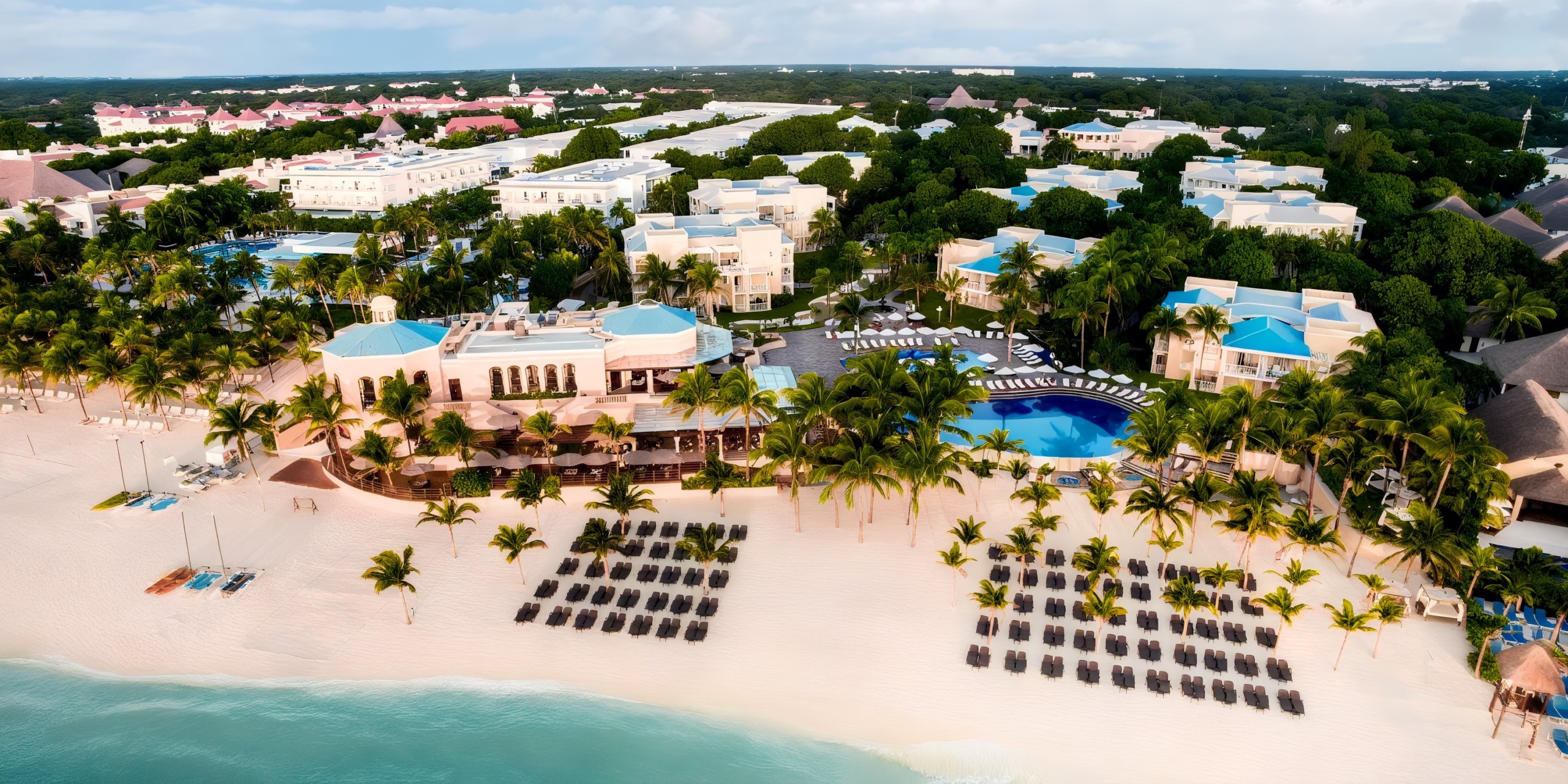 Royal Hideaway Playacar adults-only luxury all-inclusive resort with lush gardens, elegant architecture, and beachfront setting in Playa del Carmen, Mexico.